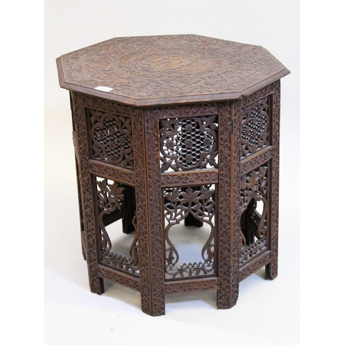 1802 - Indian octagonal carved hardwood occasional table, on a folding support