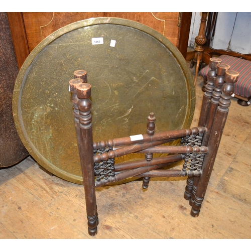 1863 - Circular Benares brass table on a wooden folding stand