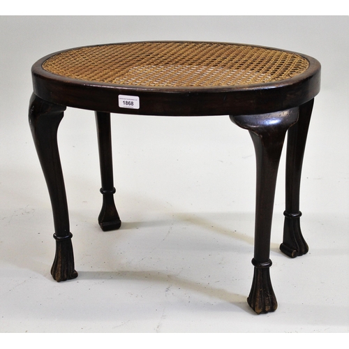 1868 - 1930's Oval walnut cane seated stool, raised on cabriole supports, with shaped feet