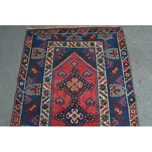 19 - Modern Turkish rug with a triple medallion design in shades of red and blue, 204cms x 121cms