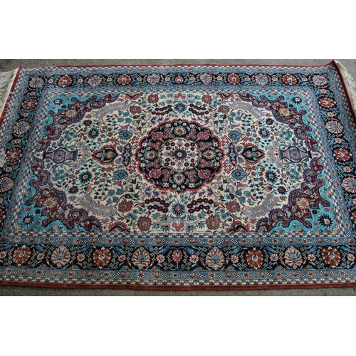20 - Modern Qum type rug with a medallion and all-over floral design, on ivory ground with pale blue turq... 