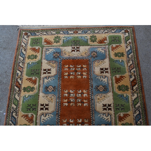 24 - Modern Milas (Turkey) rug with a rectangular centre medallion and double border, in shades of rust, ... 
