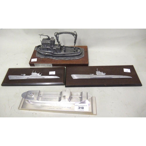 310 - 1961 Polished aluminium model of a Greek ship, two miniature half hull metal models on Bakelite boar... 