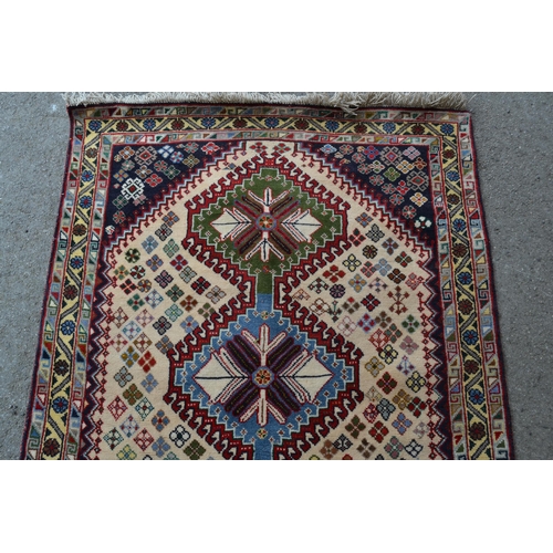 35 - Small modern rug of Southwest Persian design, with a triple hooked medallion and all-over flower hea... 