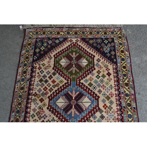 35 - Small modern rug of Southwest Persian design, with a triple hooked medallion and all-over flower hea... 