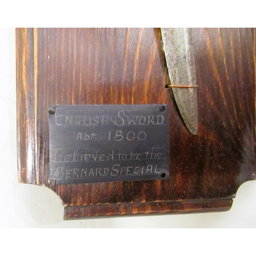 410 - Early 19th Century sabre mounted on a wooden display board