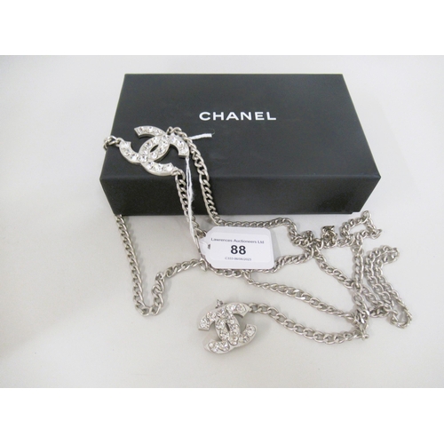 88 - Chanel, 2004, metal chainlink belt, the logos embellished with heart shaped crystals, with a Chanel ... 