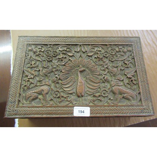 194 - Indian carved wooden rectangular workbox, together with a silver backed mirror