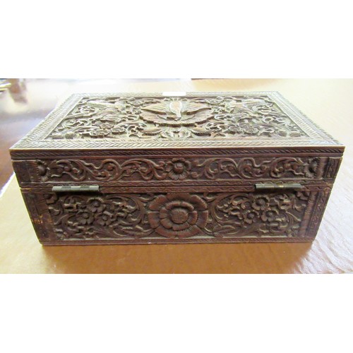 194 - Indian carved wooden rectangular workbox, together with a silver backed mirror