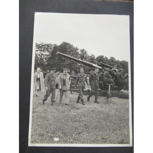 241 - Album containing a collection of World War II photographs, some including Churchill