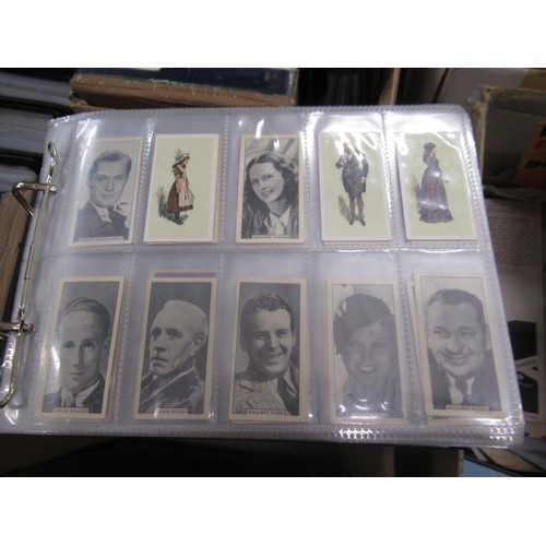 319 - Four albums containing a collection of odds of cigarette cards from manufacturers A&B (including Sca... 