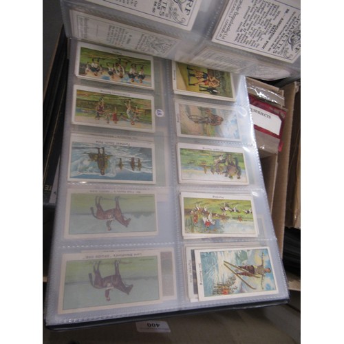 319 - Four albums containing a collection of odds of cigarette cards from manufacturers A&B (including Sca... 