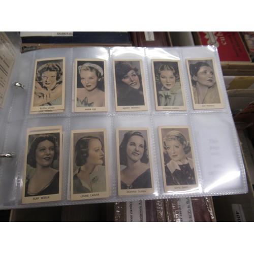 319 - Four albums containing a collection of odds of cigarette cards from manufacturers A&B (including Sca... 