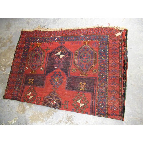 3 - Kurdish rug with a large centre medallion and subsidiary hooked medallion motifs in shades of chiefl... 