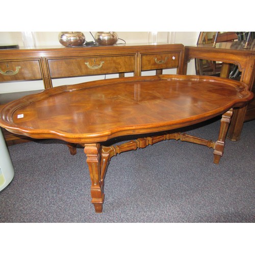 1835 - American oval cherry wood coffee table, with a shaped moulded top