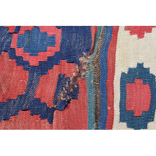 14 - Kelim runner with all-over hooked medallion design in shades of red, blue, cream and yellow, 340cms ... 