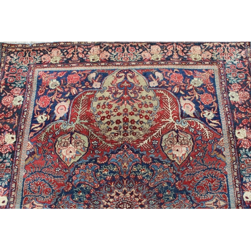 17 - Tabriz rug with a central medallion and all-over floral design with red ground and floral borders, 1... 