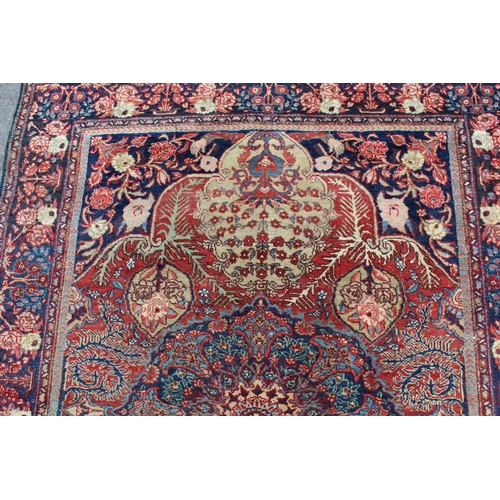 17 - Tabriz rug with a central medallion and all-over floral design with red ground and floral borders, 1... 