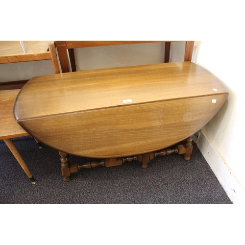 1859 - Ercol oval drop-leaf coffee table on turned supports, 107cms wide together with a similar lamp table... 