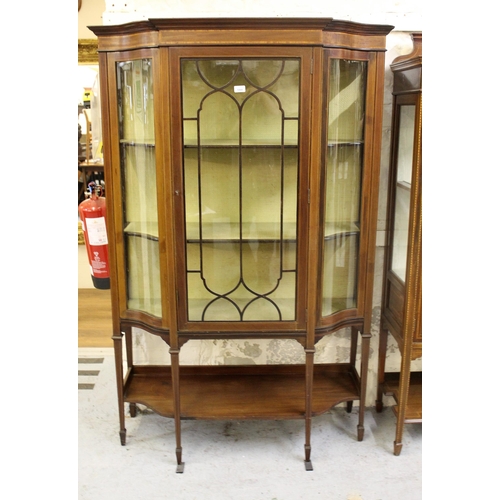 1866 - Edwardian mahogany display cabinet with glazed door enclosing shelves and having serpentine sides wi... 