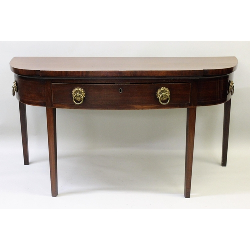 1881 - George III mahogany semi bow front serving table with a single drawer, brass ring handles and square... 