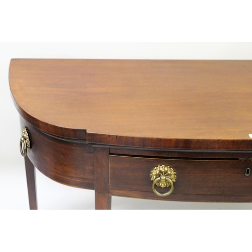 1881 - George III mahogany semi bow front serving table with a single drawer, brass ring handles and square... 