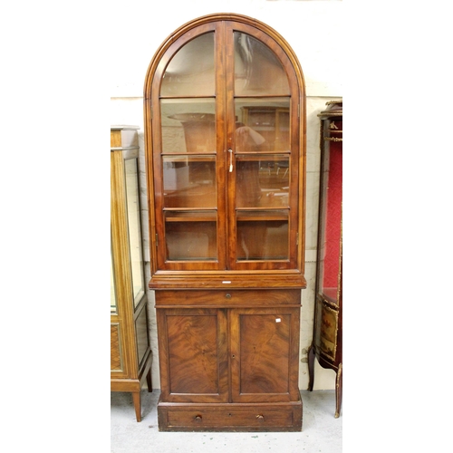 1882 - Victorian mahogany bookcase, the dome top above a pair of bar glazed doors, the base with a pair of ... 