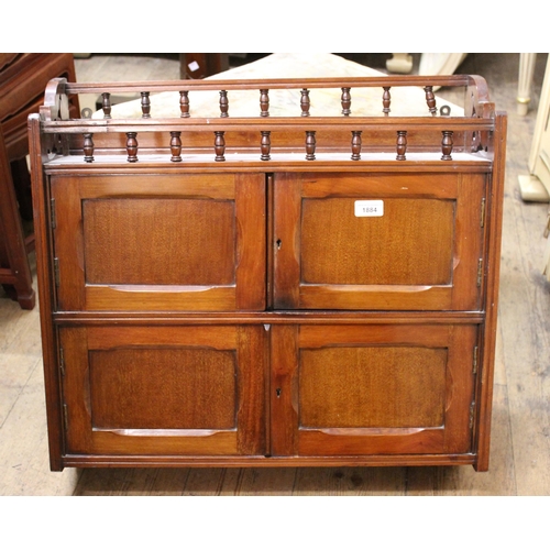 1884 - Small Victorian mahogany four door wall cabinet with a spindle galleried top, 63.5cms wide