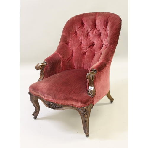 1899 - Victorian carved walnut and button upholstered tub shaped drawing room chair with a floral carved fr... 