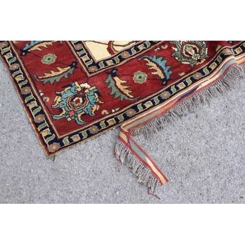 19 - Modern Turkish carpet with an all-over palmette design, on ivory ground with rust ground borders (da... 