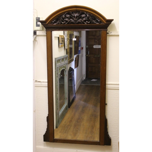 1902 - Late 19th / early 20th Century walnut wall mirror with a carved broken arch surmount, 166cms x 85cms