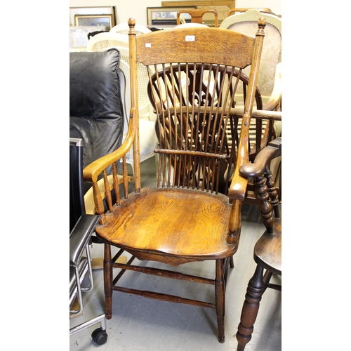 1910 - American oak spindle back open kitchen elbow chair on turned supports with peripheral stretchers