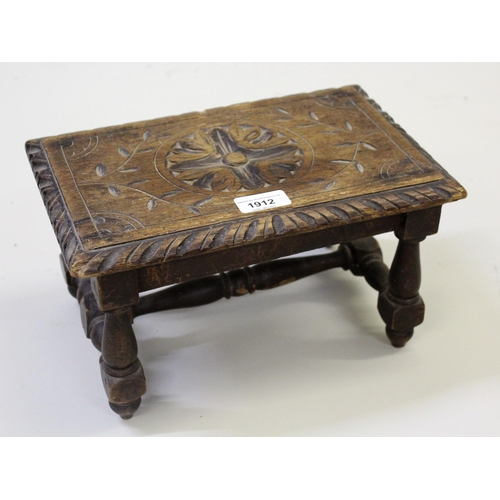 1912 - Small 19th Century oak floral carved rectangular low footstool on turned supports with 'H' stretcher