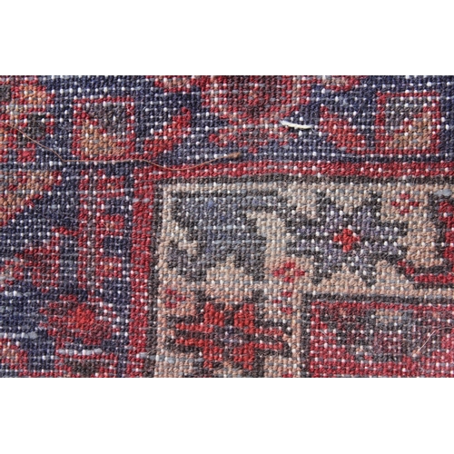 21 - Hamadan rug with a lobed medallion and all-over Herati design in shades of predominantly red and blu... 