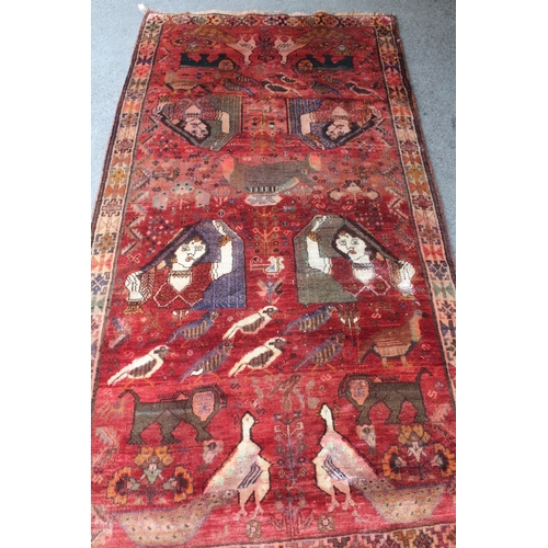 22 - Modern Gabbeh rug with an all-over animal, bird and pictorial design on a red ground with borders, 2... 