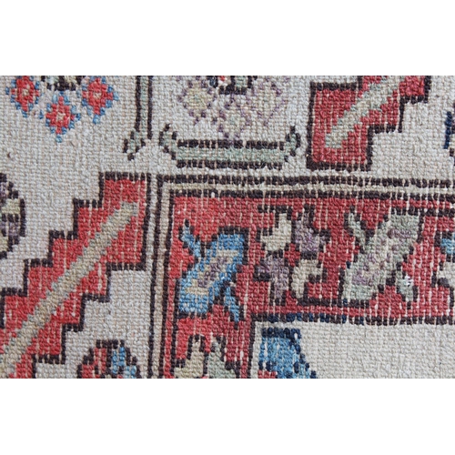 25 - Antique Kurdish rug with a lobed medallion design in shades of red, blue and beige (some wear)