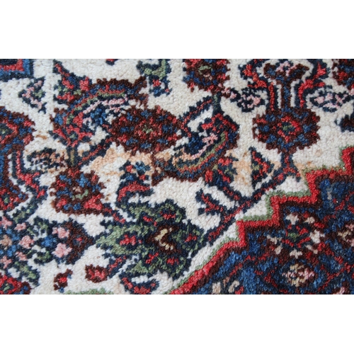 27 - Large Hamadan carpet of all-over Herati design in shades of blue, red and cream, 14ft x 11ft approxi... 