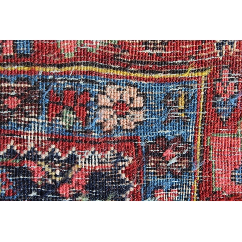 28 - Small antique Bidjar rug with a medallion and a plain design, with Herati corner designs and borders... 