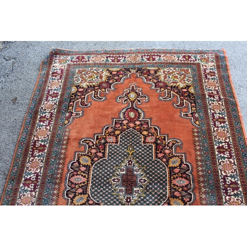 31 - Indo Persian rug with a lobed medallion and plain design, with corner designs and borders, 195cms x ... 