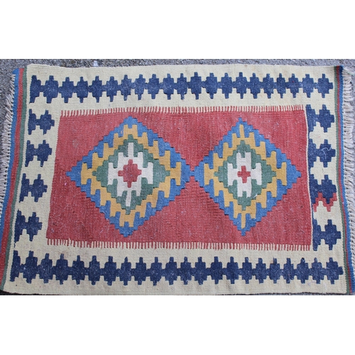 33 - Two small Kelim mats, the largest 90cms x 71cms