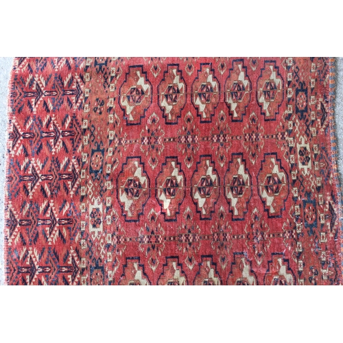 34 - Antique Tekke Juval with five rows of five gols on a wine ground with borders and skirt panel, (vari... 