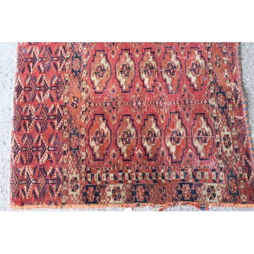 34 - Antique Tekke Juval with five rows of five gols on a wine ground with borders and skirt panel, (vari... 