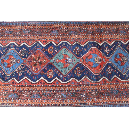 38 - Afshar runner with a repeating polychrome pole medallion design on a midnight blue ground with multi... 