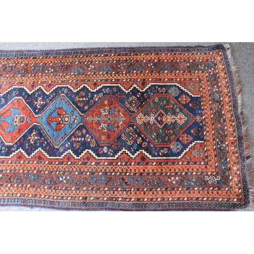 38 - Afshar runner with a repeating polychrome pole medallion design on a midnight blue ground with multi... 