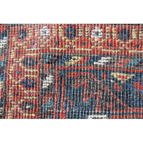 38 - Afshar runner with a repeating polychrome pole medallion design on a midnight blue ground with multi... 