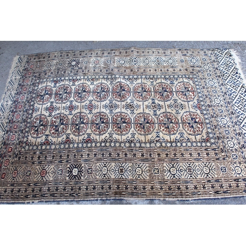 49 - Turkoman rug, the three rows of gols and multiple borders on a washed beige, red and blue ground, to... 