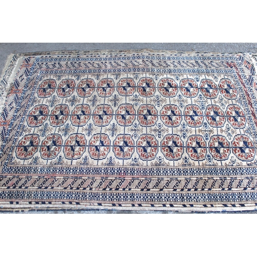 49 - Turkoman rug, the three rows of gols and multiple borders on a washed beige, red and blue ground, to... 