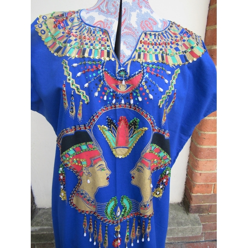 54 - Long blue dress / tabard, gold painted and beaded with Egyptian motifs