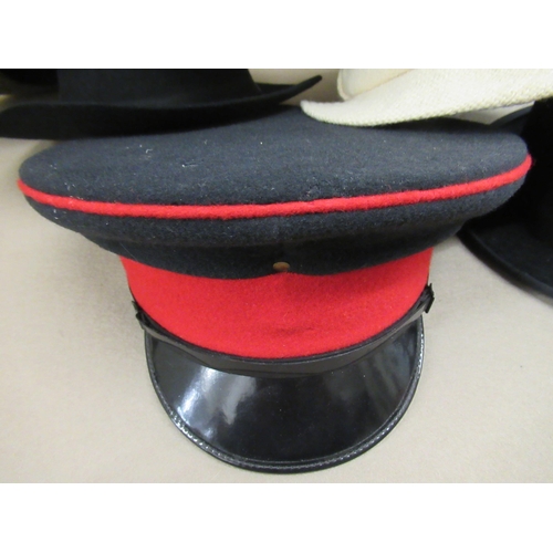 57 - Gentleman's top hat, a bowler hat, military cap and various other hats