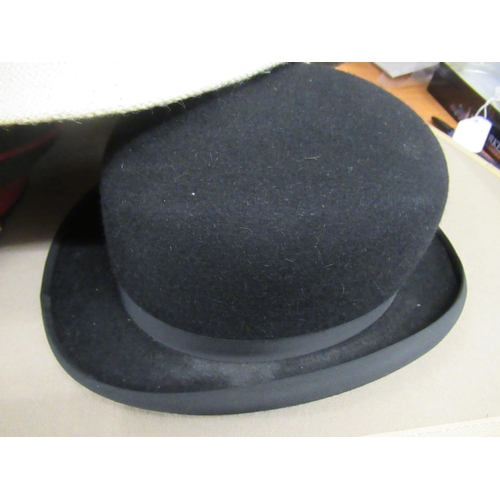 57 - Gentleman's top hat, a bowler hat, military cap and various other hats